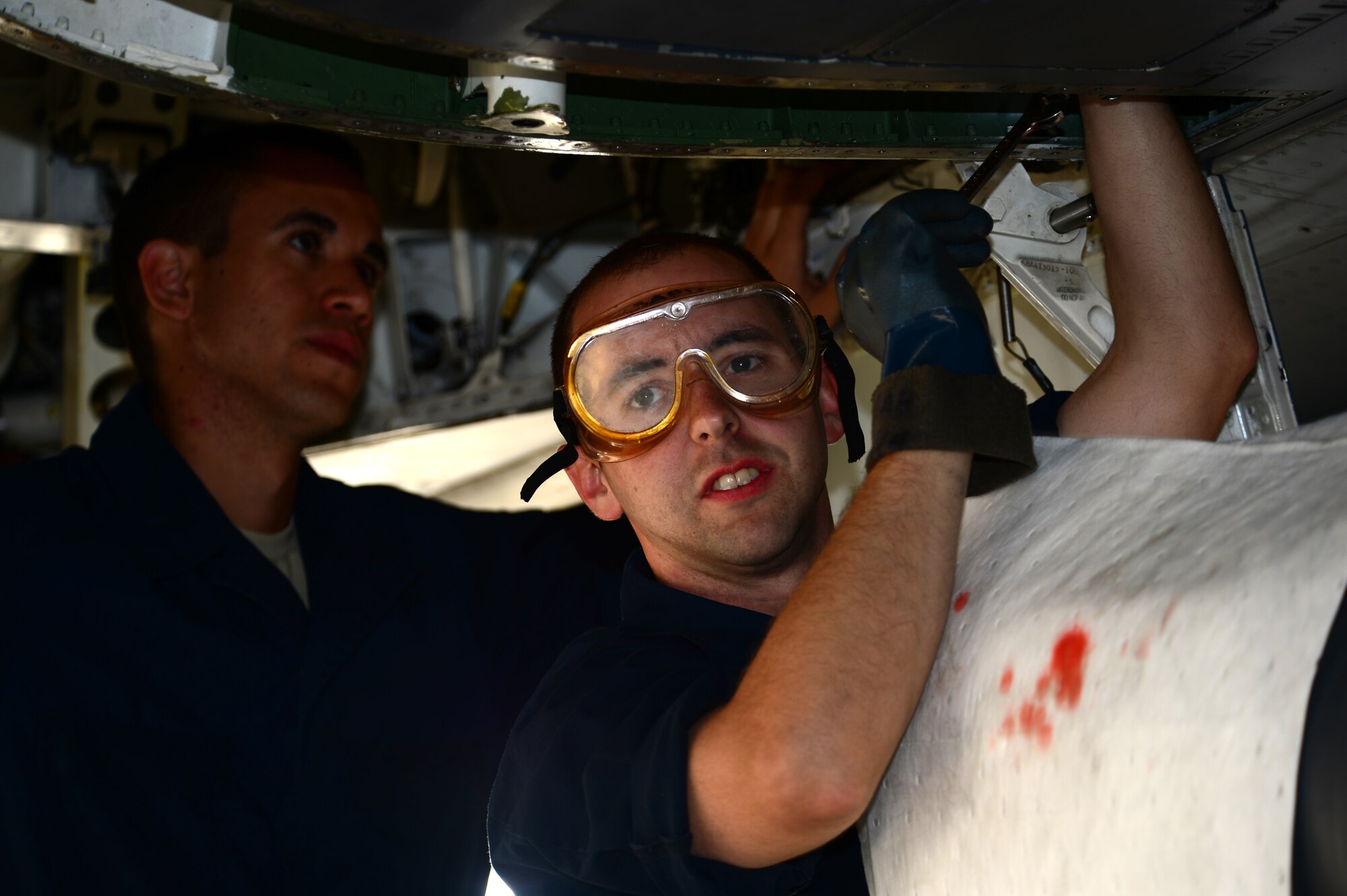 Staff Sgt. David Shuster and Airman 1st Class Joseph Sanchez, both 48th Aircraft Maintenance Squadron crew chiefs, perform maintenance procedures on an F-15E Strike Eagle during Blue Flag exercise at Uvda Air Force Base, Israel,  Nov. 21, 2013. Blue Flag was a combined aerial warfare exercise to improve operational capability, combat effectiveness, understanding and cooperation between the U.S., Israel, Greece and Italy Nov. 24-28.  (U.S. Air Force photo by Master Sgt. Lee Osberry/Released)