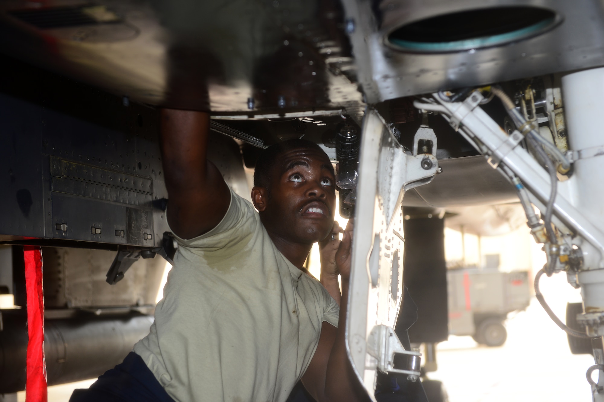 Airman 1st Class Johnny Brown, 48th Aircraft Maintenance Squadron crew chief, performs maintenance procedures on an F-15E Strike Eagle prior to Blue Flag exercise at Uvda Air Force Base, Israel, Nov. 18, 2013.  Blue Flag was a combined aerial warfare exercise to improve operational capability, combat effectiveness, understanding and cooperation between the U.S., Israel, Greece and Italy Nov. 24-28. (U.S. Air Force photo by Master Sgt. Lee Osberry/Released)