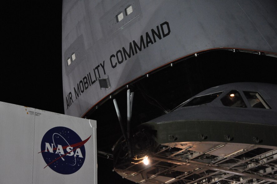 A Global Precipitation Measurement Satellite is carefully loaded into a C-5M Super Galaxy Nov. 20, 2013, at Joint Base Andrews, Md. Airmen from the 69th Aerial Port Squadron worked hand-in-hand with NASA engineers to ensure the delicate cargo was not damaged during the load. (U.S. Air Force photo/ Staff Sgt. Katie Spencer)