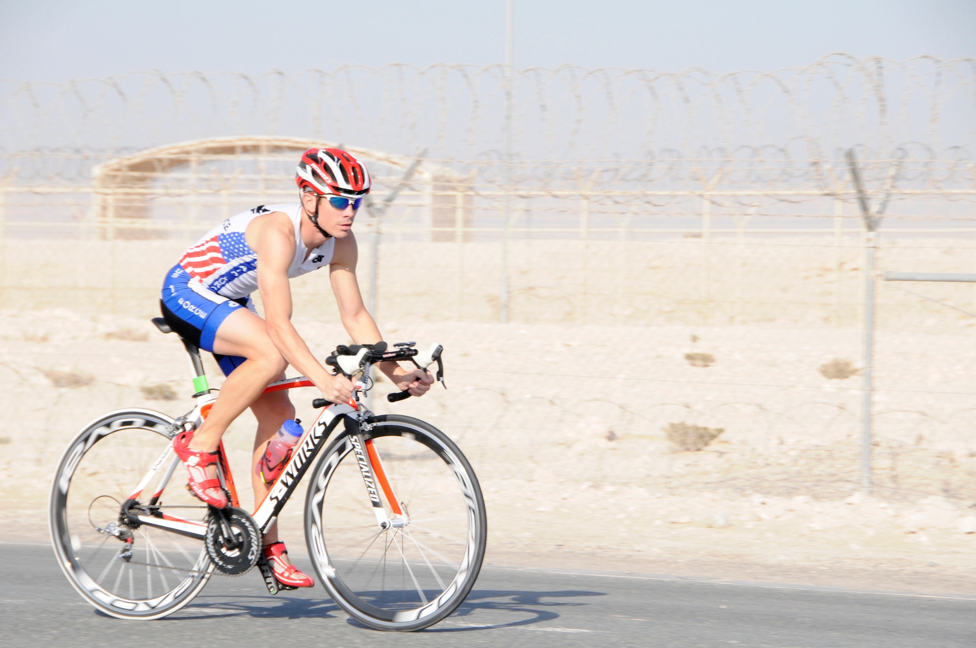 Tech. Sgt.  Ryan Oliver trains for a local triathlon at the 379th Air Expeditionary Wing in Southwest Asia, November 26, 2013. Oliver is a 379th Expeditionary Civil Engineering Squadron Explosive Ordnance Disposal technician deployed from Peterson Air Force Base, Colo., and a Panama City, Fla. native. (U.S. Air Force photo/Senior Airman Hannah Landeros)