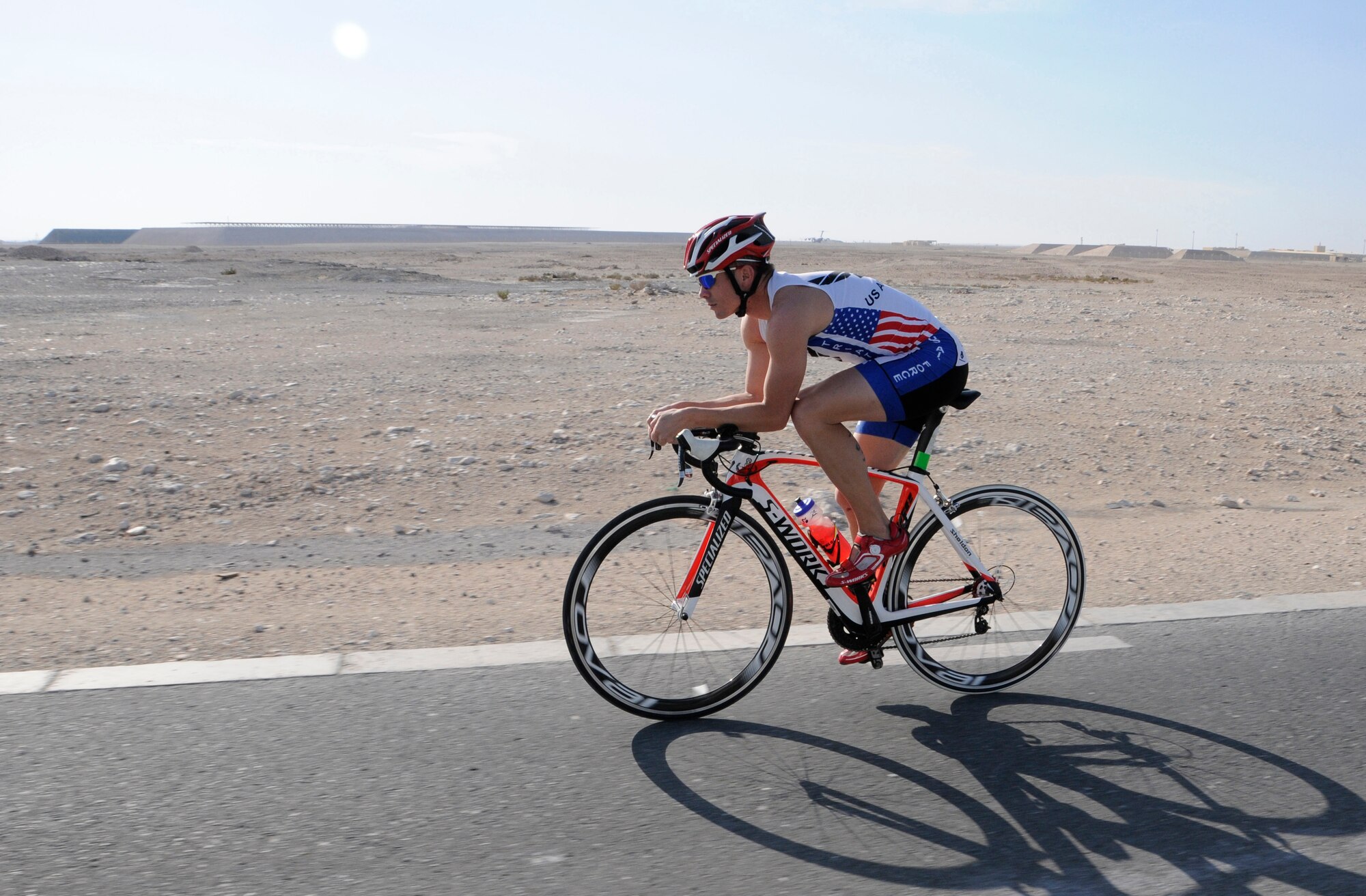 Tech. Sgt.  Ryan Oliver trains for a local triathlon at the 379th Air Expeditionary Wing in Southwest Asia, November 26, 2013. Oliver is a 379th Expeditionary Civil Engineering Squadron Explosive Ordnance Disposal technician deployed from Peterson Air Force Base, Colo., and a Panama City, Fla. native. (U.S. Air Force photo/Senior Airman Hannah Landeros)