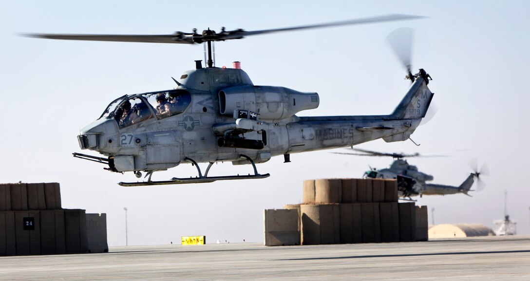 U.S. Marines Corps pilots return to Camp Bastion in their AH-1 Cobra attack helicopter following a routine mission in Helmand province, Afghanistan, Nov. 28, 2013. The pilots are assigned to Marine Light Attack Helicopter Squadron 369.