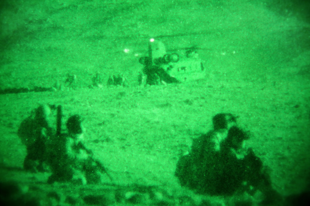 As seen through a nightvision device, U.S. coalition forces and Afghan