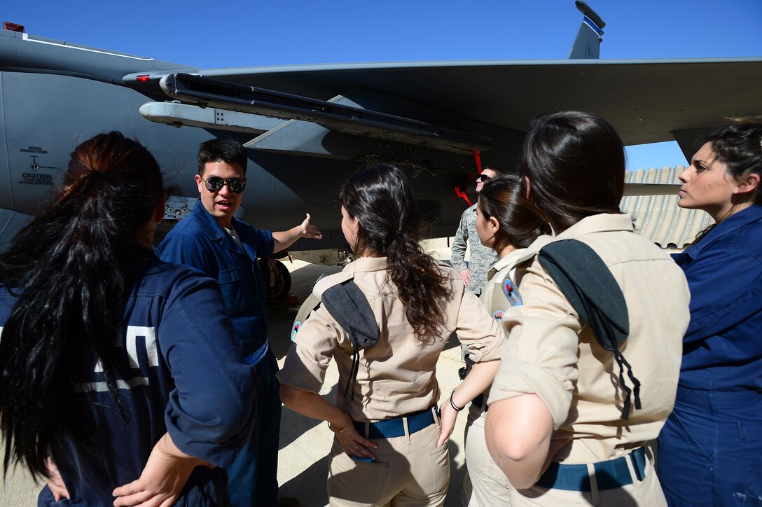 Senior Airman John Dikes talks with Israeli and Italian maintainers about the F-15E Strike Eagle during the Blue Flag exercise Nov. 26, 2013, at Uvda Air Force Base, Israel. Under abnormal conditions and in an unfamiliar location, maintainers from Royal Air Force Lakenheath had to use creative thinking and adaptability to meet mission requirements.  Dikes is a weapons loader with the 48th Aircraft Maintenance Squadron.(U.S. Air Force photo/Master Sgt. Lee Osberry)