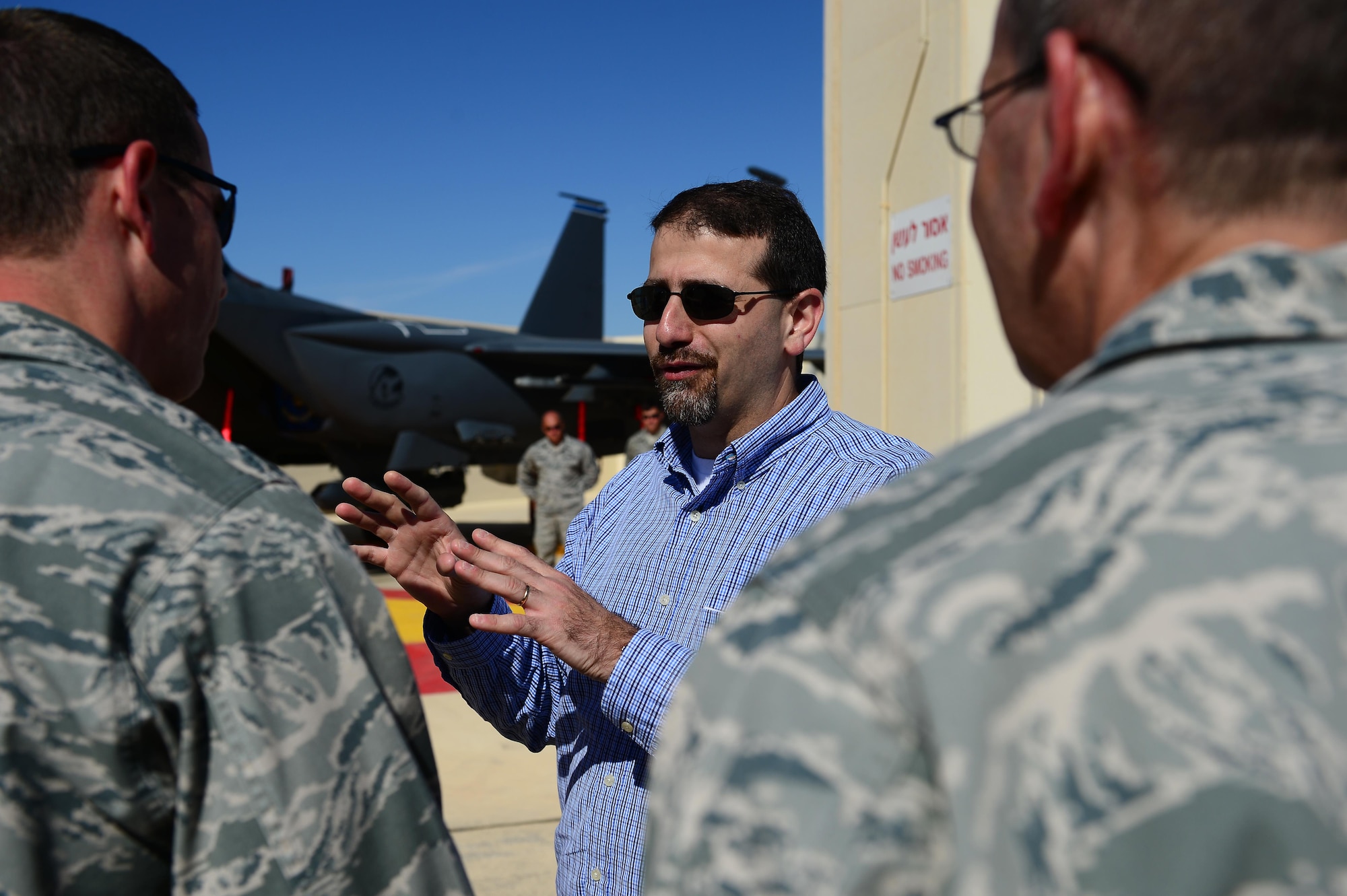 Dan Shapiro, U.S. Ambassador to Israel, talks with Capt. James Antone, 48th Aircraft Maintenance Squadron detachment commander (left), about post mission procedures Nov. 25, 2013, during the Blue Flag exercise at Uvda Air Force Base, Israel.  (U.S. Air Force photo/Master Sgt. Lee Osberry)