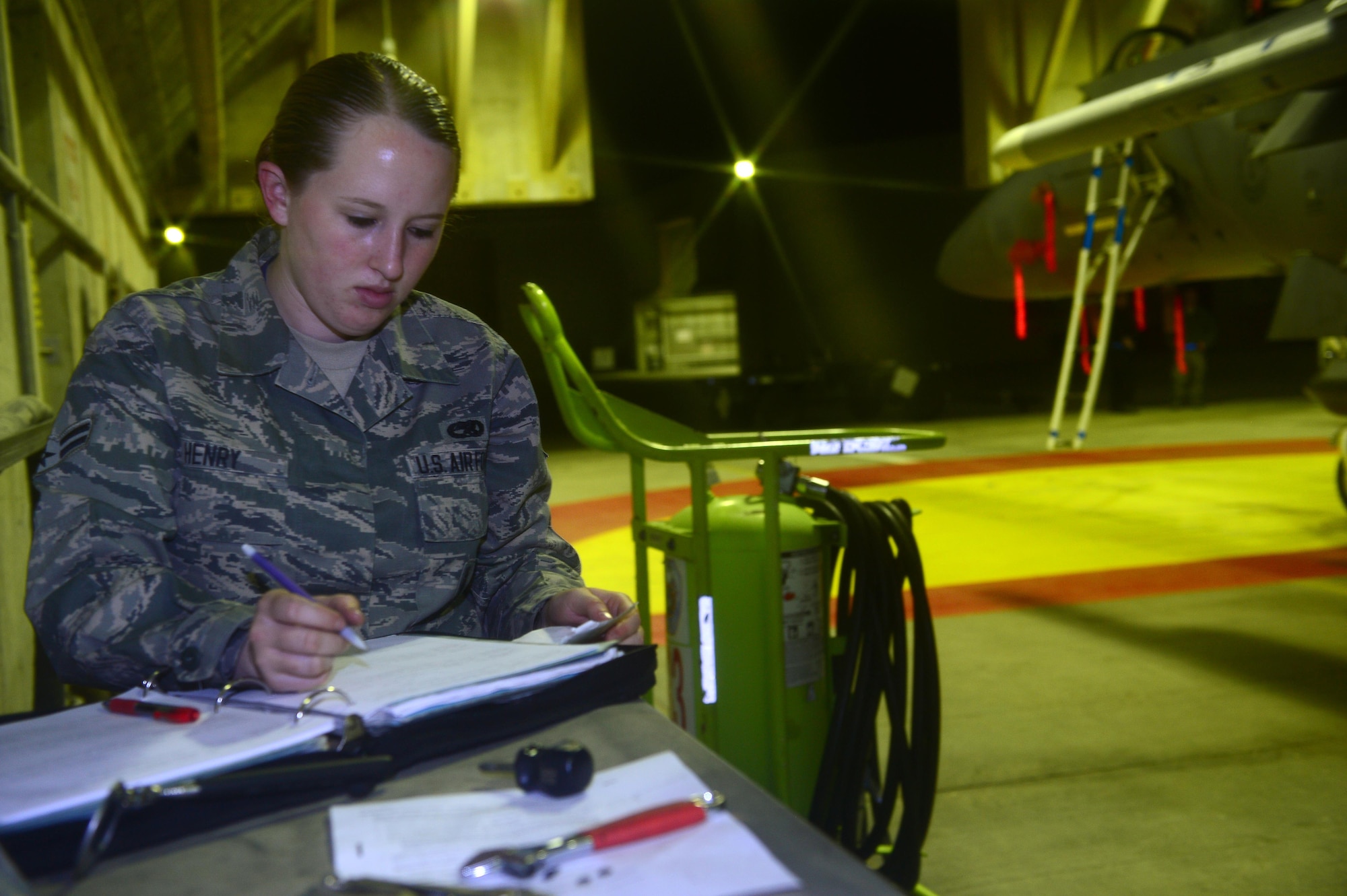 Airman 1st Class Katelyn Henry prepares forms for the next day's mission, during the Blue Flag exercise Nov. 24, 2013, at Uvda Air Force Base, Israel. Under abnormal conditions and in an unfamiliar location, maintainers from Royal Air Force Lakenheath had to use creative thinking and adaptability to meet mission requirements.  Henry is an aircraft armament systems apprentice with the 48th Aircraft Maintenance Squadron. (U.S. Air Force photo/Master Sgt. Lee Osberry)
