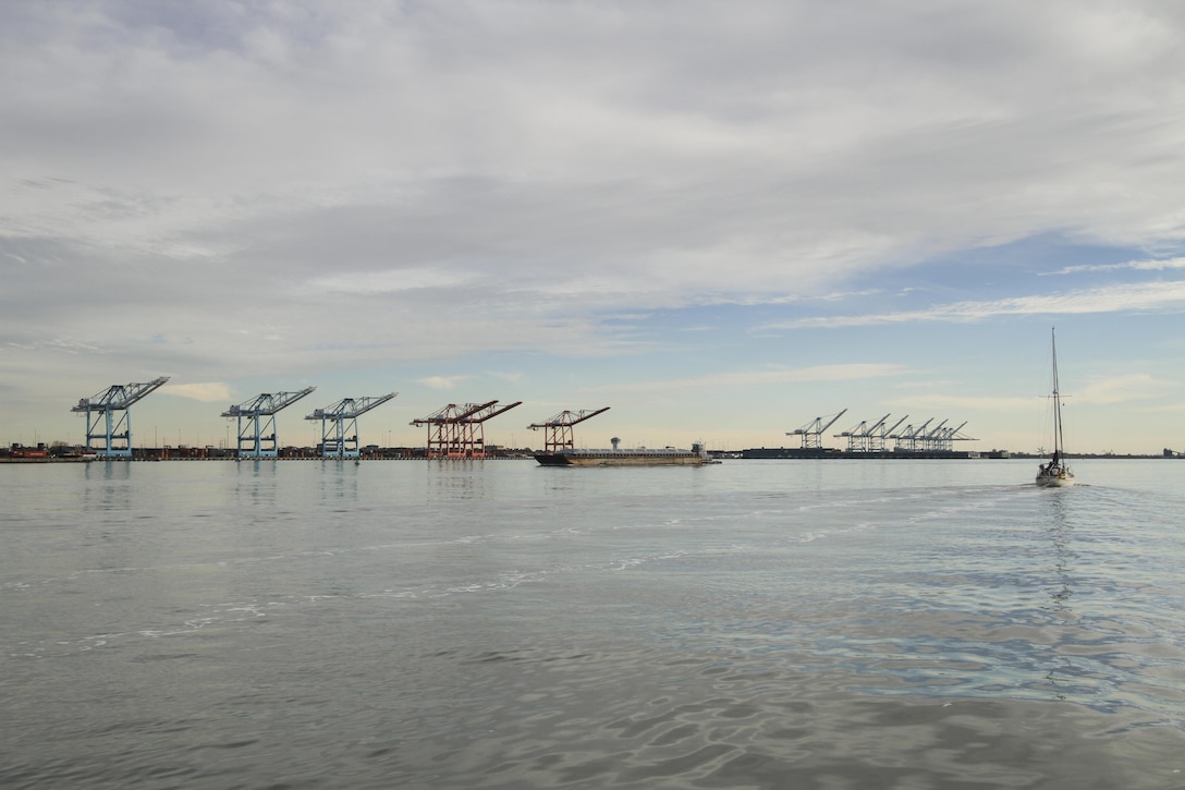 Cranes at the Virginia Port Authority's Norfolk International Terminal here stand at the ready to off-load and onload cargo ships.  