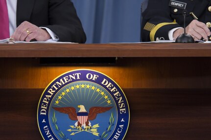 Secretary of Defense Chuck Hagel and 18th Chairman of the Joint Chiefs of Staff Gen. Martin E. Dempsey brief the press at the Pentagon, Dec. 4, 2013.  DoD photo by Mass Communication Specialist 1st Class Daniel Hinton

