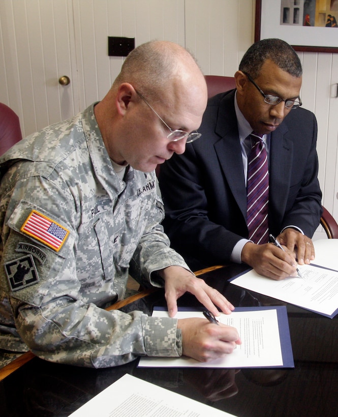 Little Rock District Commander Col. Courtney W. Paul and University of Pine Bluff Chancellor Laurence B. Alexander sign a Memorandum of Understanding for the advancement of Science, Technology, Engineering, Mathematics enrichment programs to increase the number of well-prepared underrepresented minority STEM graduates for careers in STEM professions.