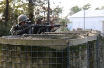 Marines with Ragnarok Company, 2nd Supply Battalion, 2nd Marine Logistics Group provide security for a simulated forward operating base following gunshots during a basic skills course at the Battle Skills Training School aboard Camp Lejeune, N.C., Dec. 5, 2013. Marines and sailors conducted combat operations against BSTS instructors for 48 hours during the course. 