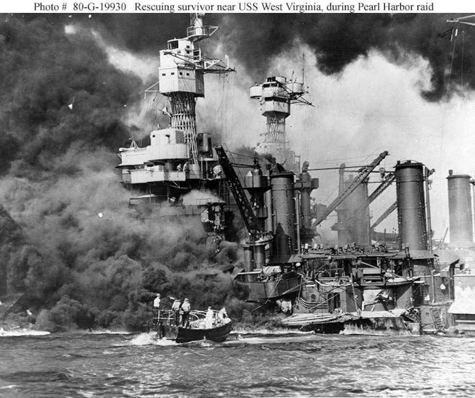 Sailors in a motor launch rescue a survivor from the water alongside the sunken USS West Virginia (BB-48) during or shortly after the Japanese air raid on Pearl Harbor on Dec. 7, 1941. This year marks the 72nd anniversary of the attack.
