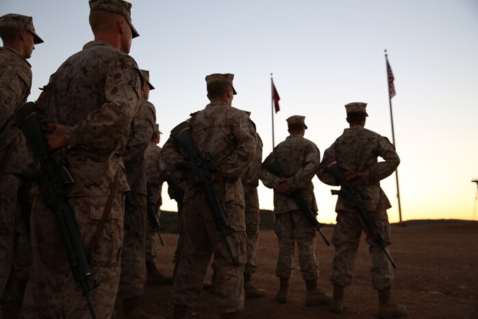 Recruits of Company B, 1st Recruit Training Battalion, stand in formation as they are given words of advice and gratitude during their Eagle, Globe, and Anchor ceremony at Edson Range aboard Marine Corps Base Camp Pendleton, Calif, Oct. 31.  “You are now tasked to uphold the values of the Marine Corps,” said Capt. Joshua M. Phelps, company commanding officer.  “Nobody can take this accomplishment away.”