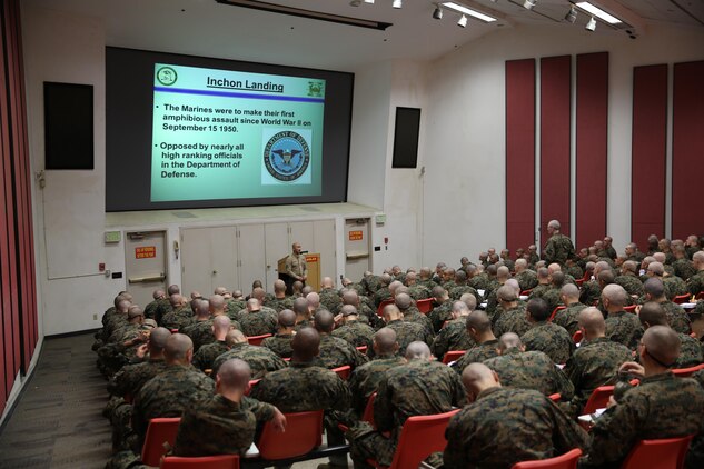 Sgt. Gersom C. Canlas, acedemic instructor, Instructional Training Company, Support Battalion teaches the recruits of Company D about the Inchon Landing during their history and honor class aboard the depot, Nov. 15. Recruits receive classes on uniform regulations, finaces, customs and courtesies, and much more throughout the duration of recruit training.