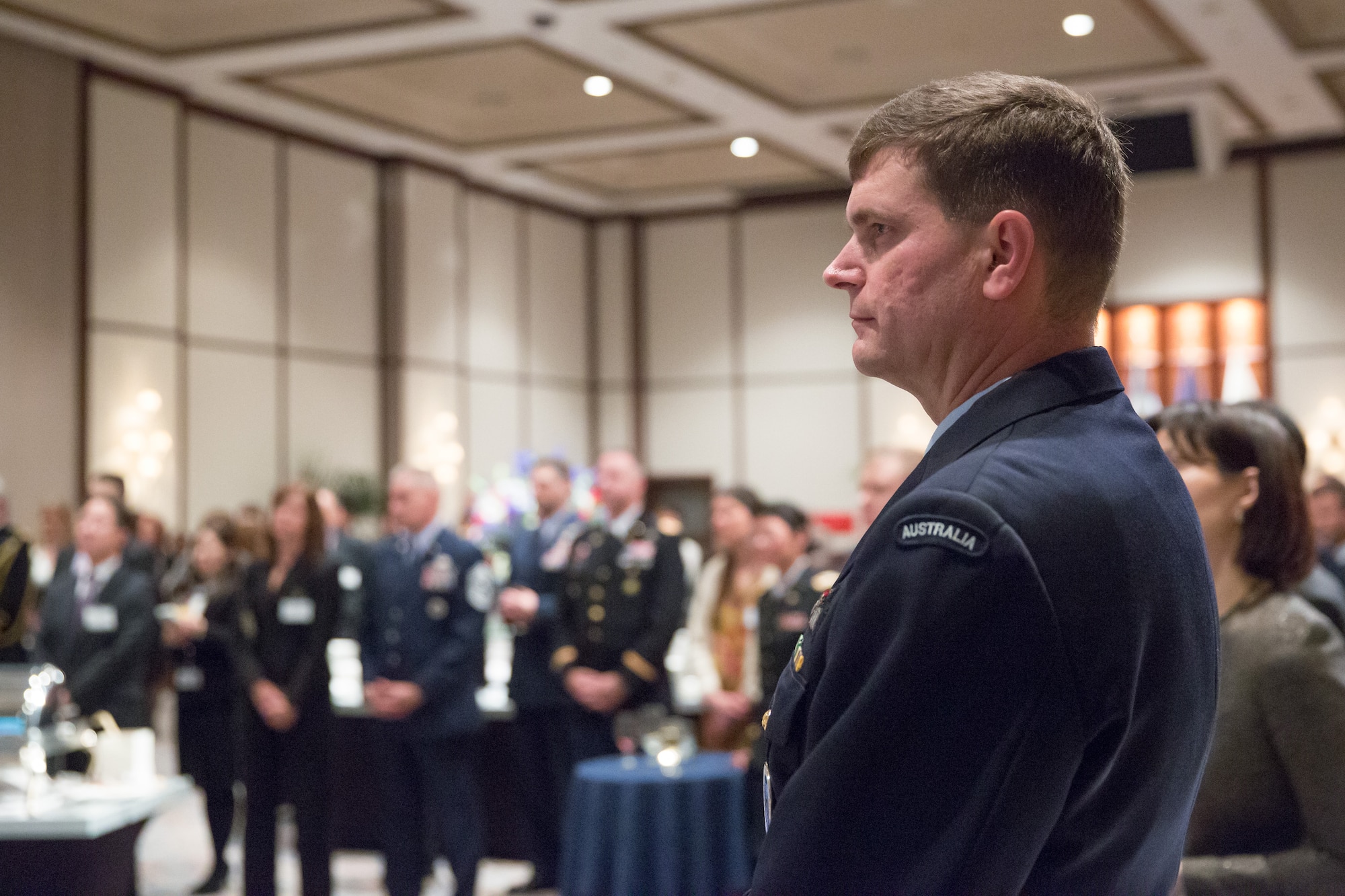 Royal Australian Air Force Group Captain Luke Stoodley, United Nations Command (Rear) commander, listens as U.S. Air Force Lt. Gen. Jan-Marc Jouas addresses the ceremony attendees during the 68th Anniversary of the United Nations, Nov. 26, 2013, at New Sanno Hotel. Jouas is the United Nations Command Korea, deputy commander, U.S. Forces Korea, deputy commander, Air Component Commander, Republic of Korea/U.S. Combined Forces Command, commander, 7th Air Force, commander. (U.S. Air Force photo by Osakabe Yasuo/Released)