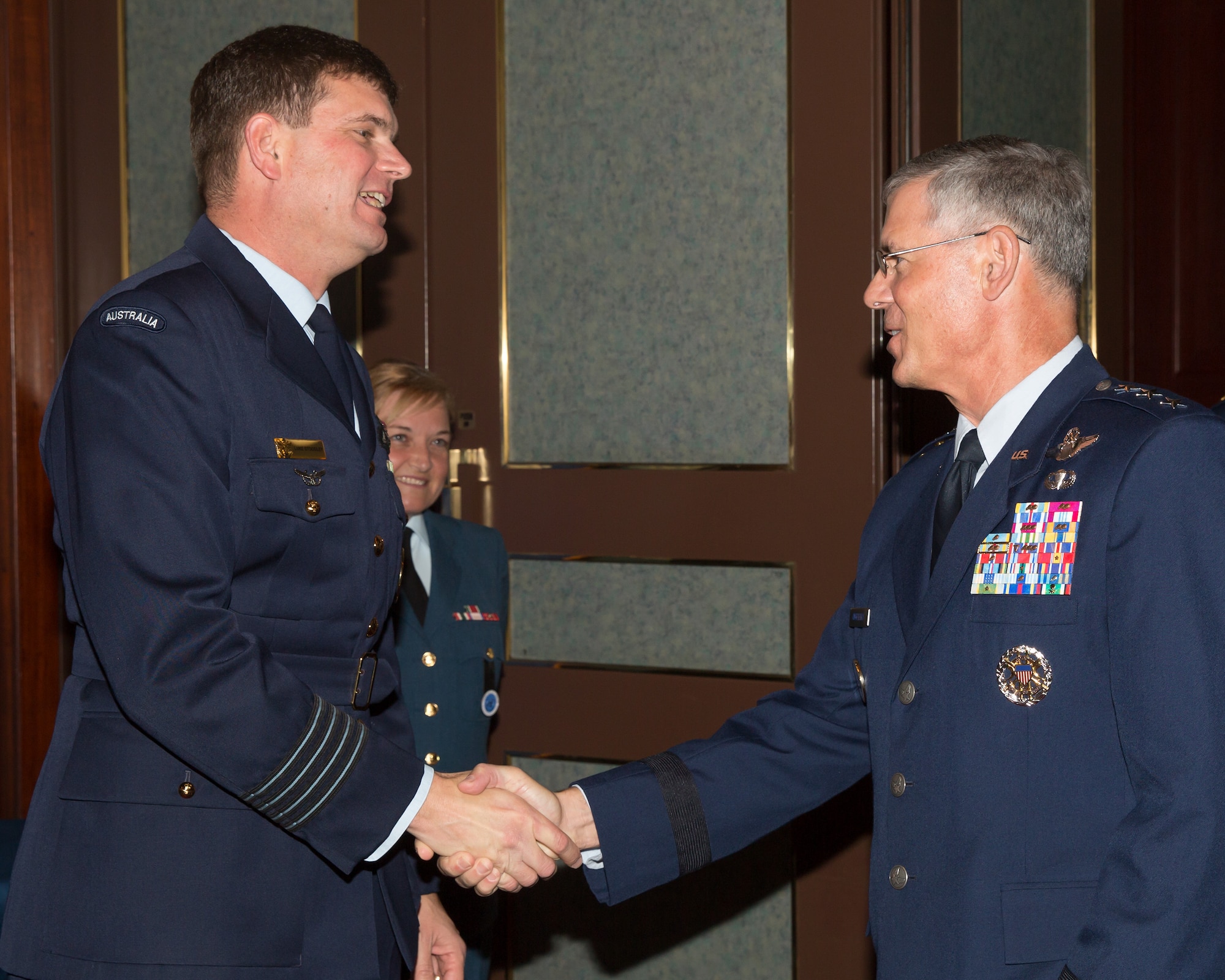 (from left to right) Royal Australian Air Force Group Captain Luke Stoodley, United Nations Command (Rear) commander, greets U.S. Air Force Lt. Gen. Sam Angelella, U.S. Forces, Japan and 5th Air Force commander, during the 68th Anniversary of the United Nations, Nov. 26, 2013 at New Sanno Hotel. The United Nations Command (Rear) provides liaison and maintains a special UN Forces – Government of Japan Status of Forces Agreement which enables forces of UN member nations to use seven U.S. installations in Japan as UNC supporting facilities in the event of a resumption of hostilities. (U.S. Air Force photo by Osakabe Yasuo/Released)
