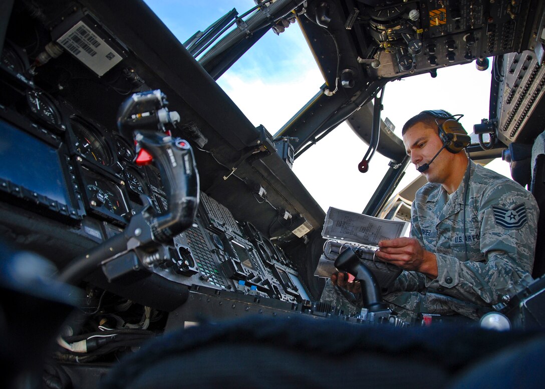 U.S. Air Force Tech. Sgt. Christopher Dominguez assigned to the 129th Rescue Wing Maintenance Squadron conducts an HH-60G Pave Hawk rescue helicopter engine run, Moffett Federal Airfield, Calif., Nov. 26, 2013.  Engine troops and maintainers have many responsibilities and can be tasked to maintain multiple aircrafts and engines types.  They know and implement a great deal of knowledge on a daily basis.  (U.S. Air Force photo by Senior Airman John D. Pharr III /Released)