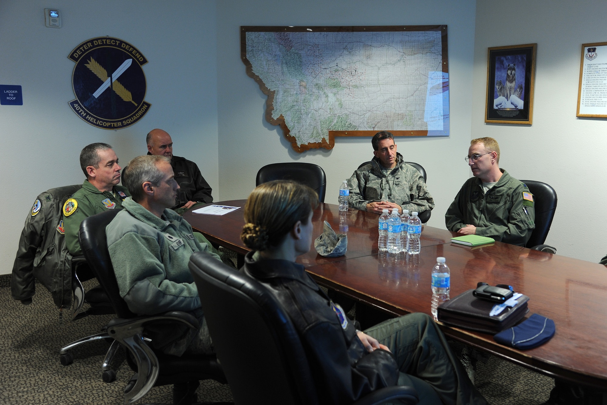 Lt. Col. John Beurer, 40th Helicopter Squadron director of operations, gives the squadron’s mission briefing to Montana Air National Guard leadership members during their tour of Malmstrom Air Force Base Nov. 26.  Their tour allowed them the ability to become acquainted with the mission of the 341st Missile Wing as well as share ideas and insights for future collaboration with the base.  (U.S. Air Force photo/Senior Airman Cortney Paxton)