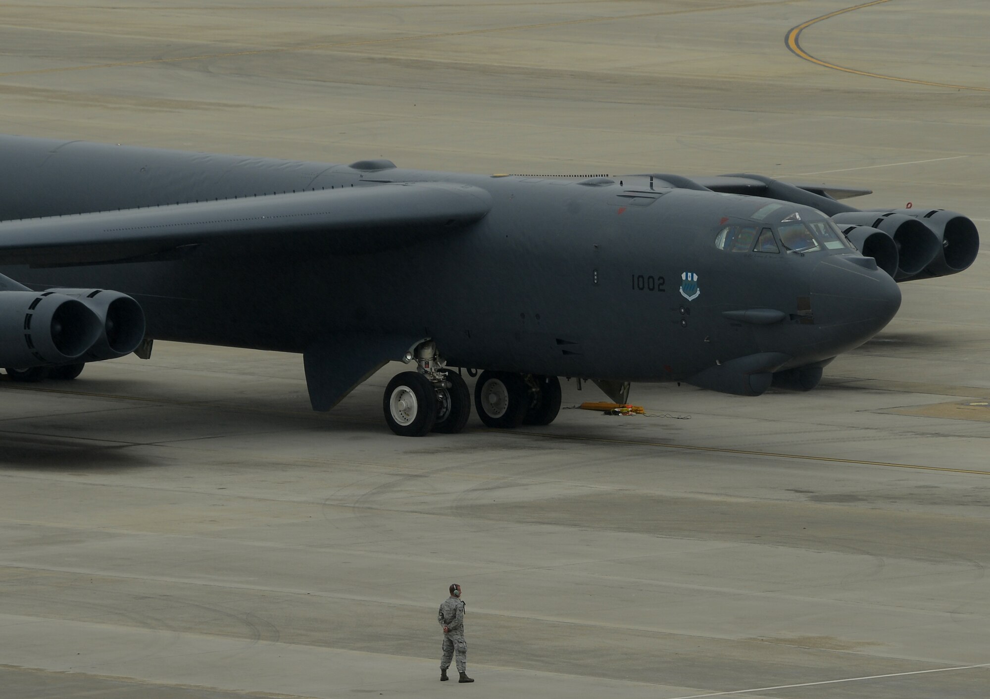A crew chief waits for his aircraft to taxi during a minimum interval takeoff on Barksdale Air Force Base, La., Dec. 5, 2013. A MITO enables Barksdale to train for one of three missions it supports; nuclear deterrence. (U.S. Air Force photo/Staff Sgt. Sean Martin)