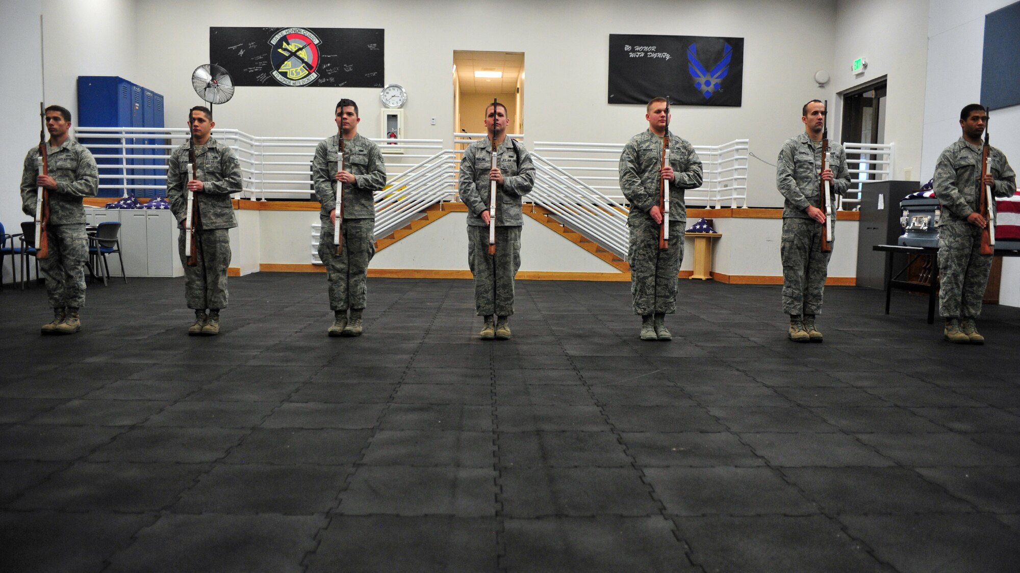 Members of the base honor guard practice firing party techniques during training at Fairchild Air Force Base, Wash., Nov. 25, 2013. Prior to a ceremony, Airmen practice their technique multiple times to ensure they are prepared for the live ceremony. (U.S. Air Force photo by Senior Airman Taylor Curry/Released)