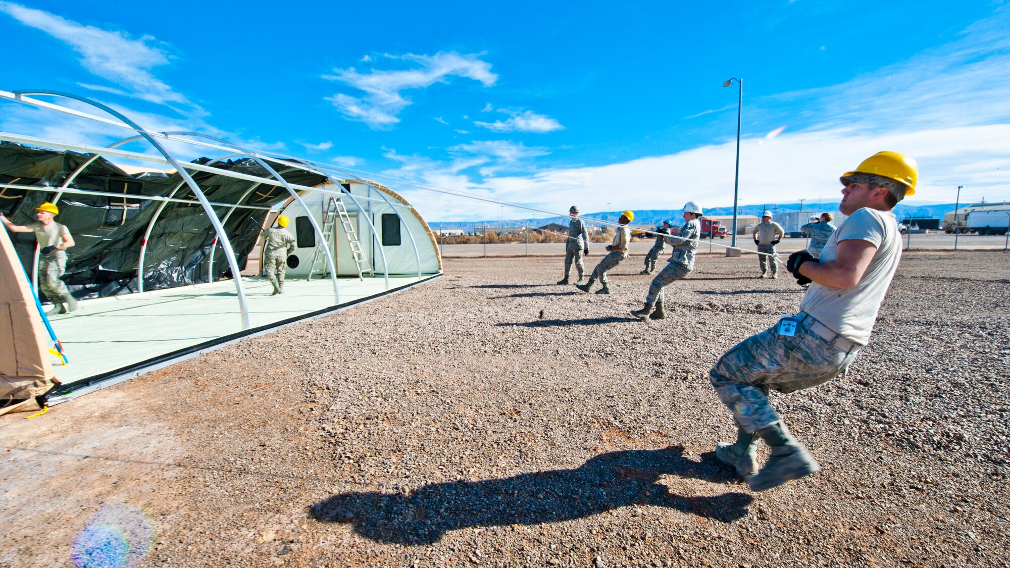49th Materiel Maintenance Squadron structures Airmen work to construct a Small Shelter System at Holloman Air Force Base, N.M., Dec. 2. The Airmen trained on building fully-ventilated structures such as the SSS to maintain skills needed during construction in deployed environments. The 49th MMS accomplishes the mission by sending large, all-inclusive packaged equipment to deployed locations or to areas impacted by natural disasters. (U.S. Air Force photo by Senior Airman Daniel E.Liddicoet/Released)
