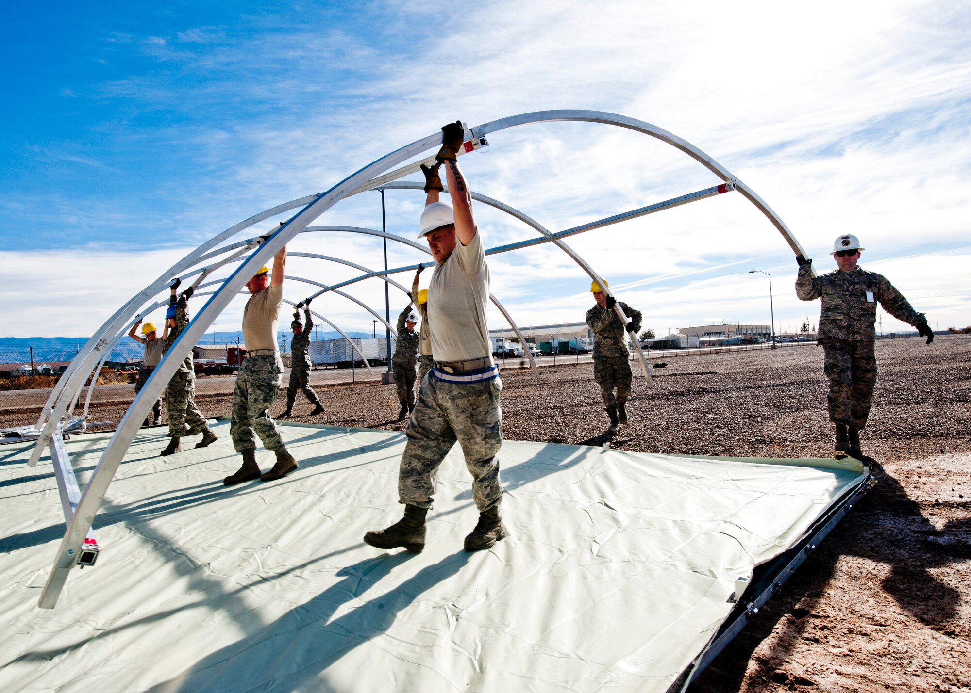 49th Materiel Maintenance Squadron structures Airmen work to construct a Small Shelter System at Holloman Air Force Base, N.M., Dec. 2. The Airmen trained on building fully-ventilated structures such as the SSS to maintain skills needed during construction in deployed environments. The 49th MMS accomplishes the mission by sending large, all-inclusive packaged equipment to deployed locations or to areas impacted by natural disasters. (U.S. Air Force photo by Senior Airman Daniel E.Liddicoet/Released)