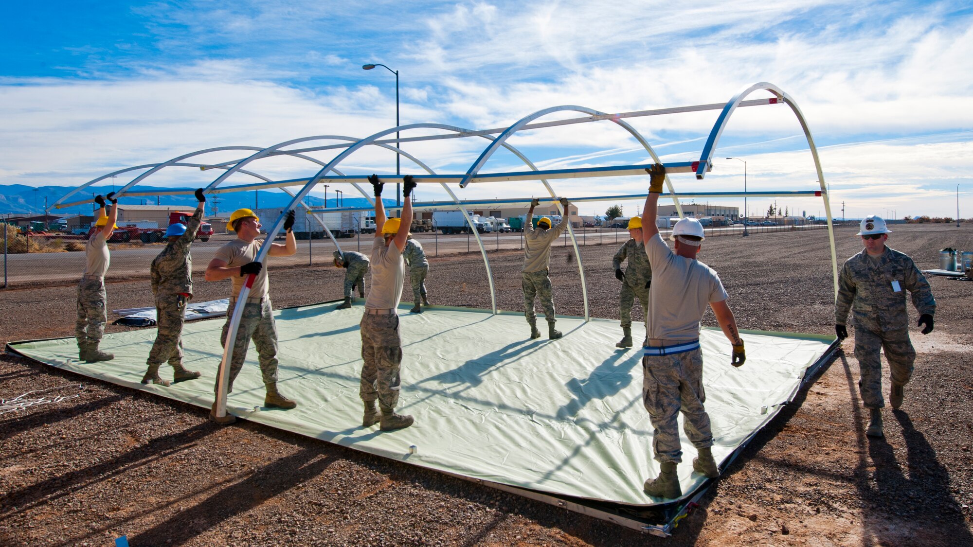 49th Materiel Maintenance Squadron structures Airmen work to construct a Small Shelter System at Holloman Air Force Base, N.M., Dec. 2. The Airmen trained on building fully-ventilated structures such as the SSS to maintain skills needed during construction in deployed environments. The 49th MMS accomplishes the mission by sending large, all-inclusive packaged equipment to deployed locations or to areas impacted by natural disasters. (U.S. Air Force photo by Senior Airman Daniel E.Liddicoet/Released)