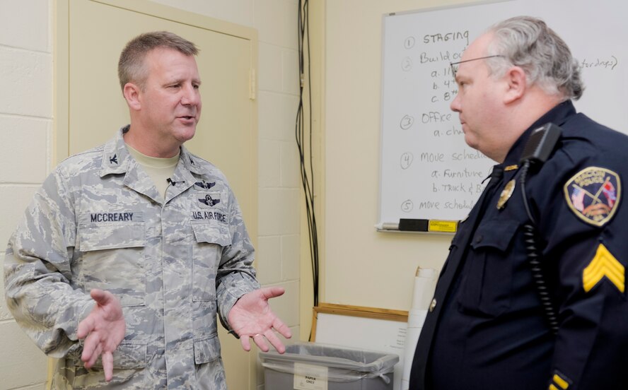 U.S. Air Force Col. Gregory McCreary, 116th Mission Support Group commander, Georgia Air National Guard, speaks with Sgt. Ricky Wolverton, Macon Police Tactical Support Unit commander, while visiting the EMA for the Georgia National Guard podium week, Macon, Ga., Dec. 5, 2013. Podium week was set up to coincide with the 377th birthday of the National Guard. Leaders from Guard units throughout the state took the opportunity to speak to various community groups about the Georgia National Guard mission and successes.  McCreary, along with Public Affairs personnel from the 116th Air Control Wing (ACW), toured the EMA facility followed by a briefing from the Colonel where he shared information about the Guard and the 116th ACW. (U.S. Air National Guard photo by Master Sgt. Roger Parsons/Released)
