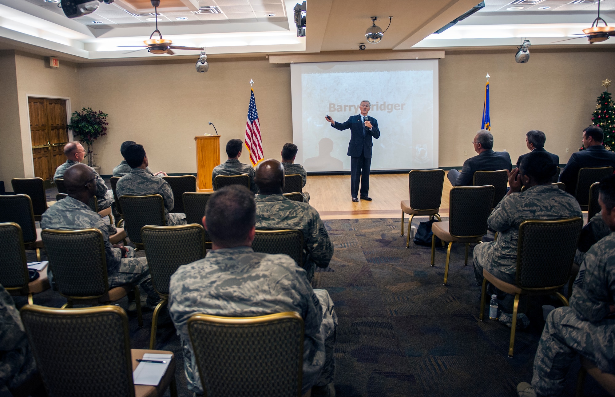 Retired U.S. Air Force Lt. Col. Barry Bridger speaks to Airmen during a seminar at Moody Air Force Base, Ga., Dec. 4, 2013. Bridger spoke as part of the 2013 Professional Development Seminar, which was sponsored by the Moody Company Grade Officer Council. (U.S. Air Force photo by Senior Airman Jarrod Grammel/Released)
