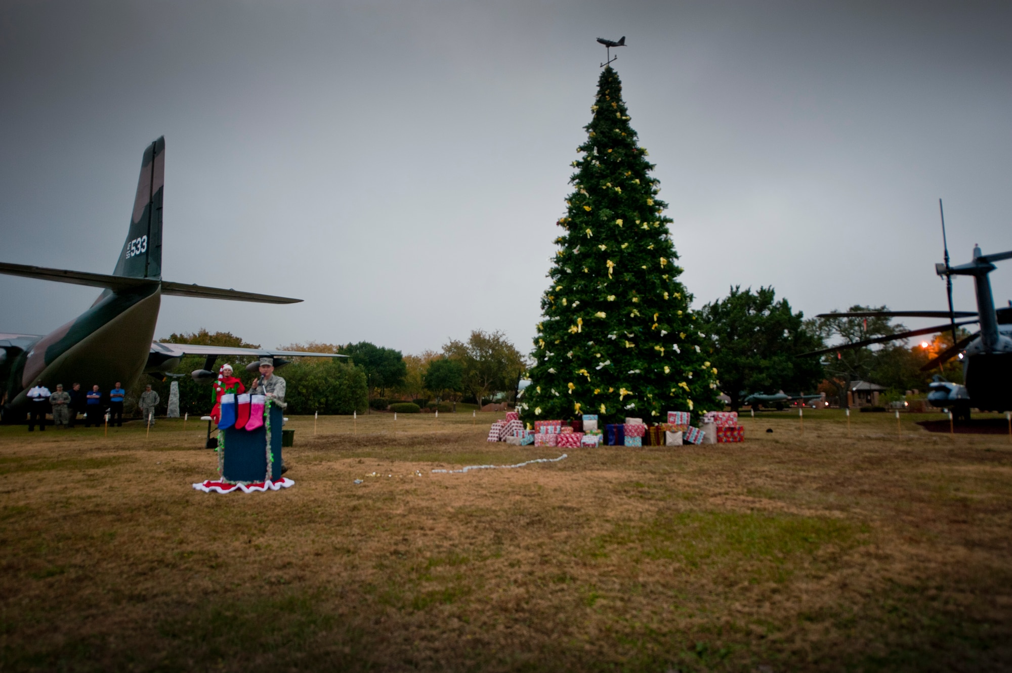 Col. William West, 1st Special Operations Wing commander, speaks prior to the holiday tree lighting ceremony at the Air Park on Hurlburt Field, Fla., Dec. 4, 2013. Santa Claus made an appearance at the event. (U.S. Air Force photo/Senior Airman Krystal M. Garrett)