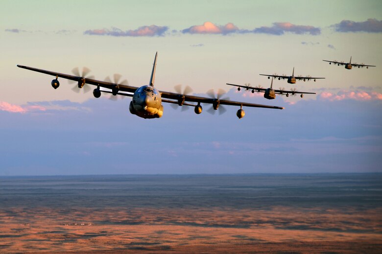 Five MC-130J Commando II's from the 522nd Special Operations Squadron at Cannon Air Force Base, N.M., conduct low level formation training Nov. 5, 2013 over Clovis, N.M. The New Mexico landscape provides an optimal training environment for air crews to hone their skills to meet the needs of the 27th Special Operations Wing. (U.S. Air Force photo/ Staff Sgt. Matthew Plew)
