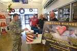 Master Sgt. Joe Davis makes a donation to Operation Warmheart Monday at Joint Base San Antonio-Randolph. (U.S. Air Force photo by Joel Martinez)