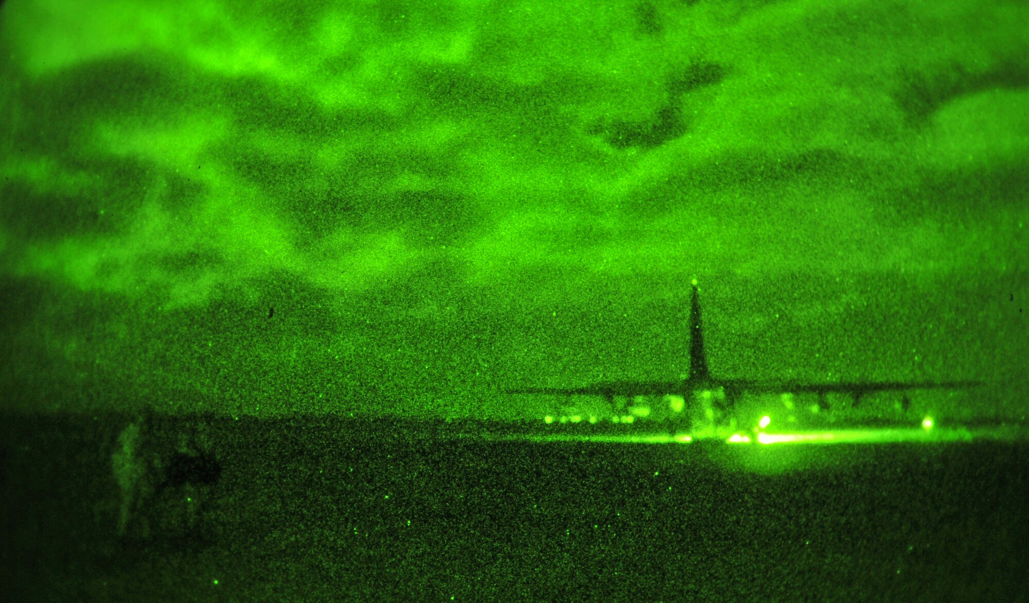 An MC-130J Commando II waits with its engines running while U.S. Air Force Airmen from the 352nd Special Operations Support Squadron carry a simulated casualty Nov. 20, 2013, during a casualty evacuation exercise. The 67th Special Operations Squadron and 352nd SOSS the CASEVAC exercise, which tested Airmen on their ability to care for and transport wounded service members under tactical conditions similar to what would be encountered in a combat environment. (U.S. Air Force photo by Senior Airman Christine Griffiths/Released)