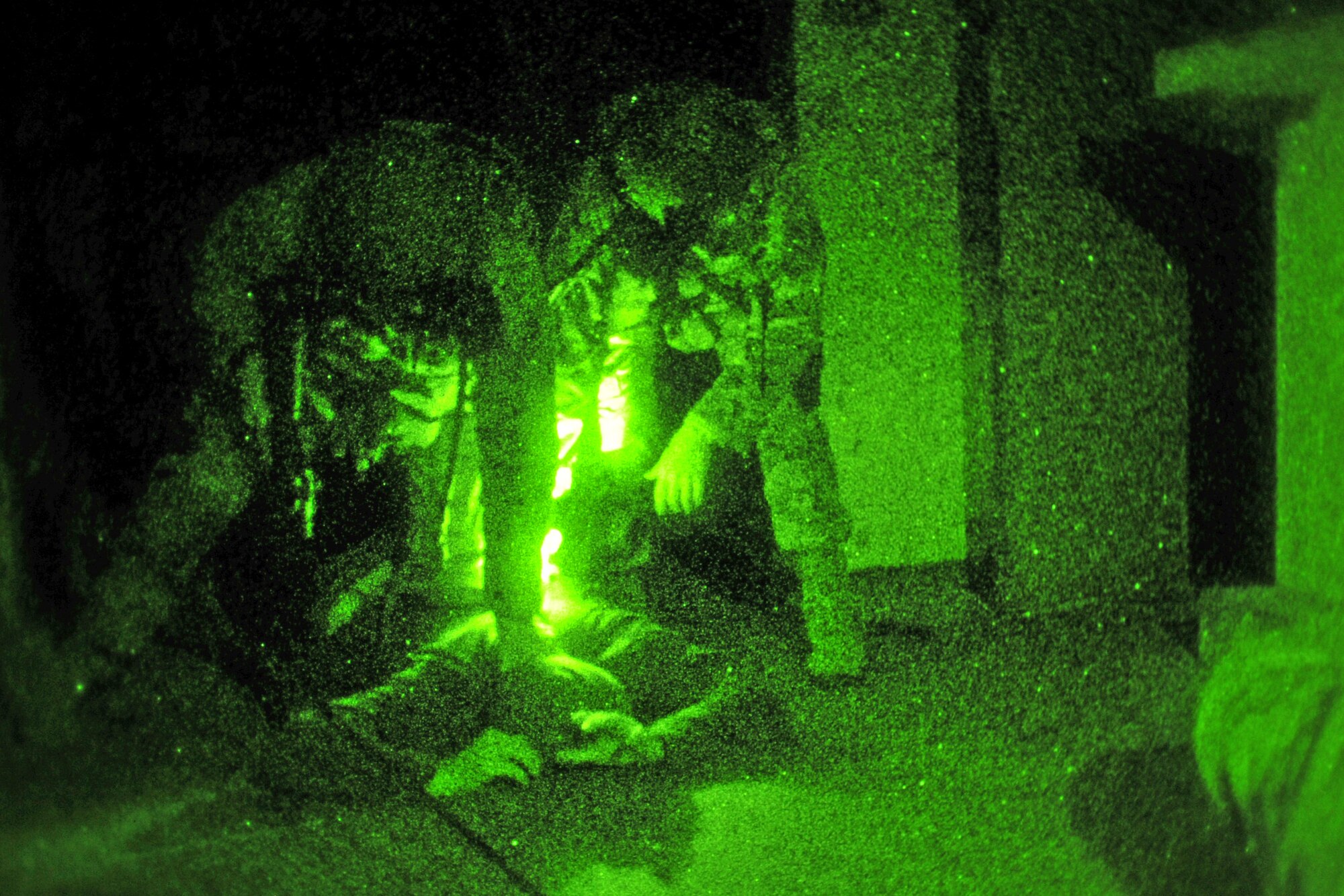 U.S. Air Force Senior Airman Seth Ewing and Tech. Sgt. Rebecca James, left to right, 352nd Special Operations Support Squadron Deployed Aircraft Ground Response Element, detain an individual Nov. 20, 2013, as part of a casualty evacuation exercise. The 67th Special Operations Squadron and 352nd SOSS participated in the exercise together, which tested Airmen on their ability to care for and transport wounded service members under tactical conditions similar to what would be encountered in a combat environment. (U.S. Air Force photo by Senior Airman Christine Griffiths/Released)