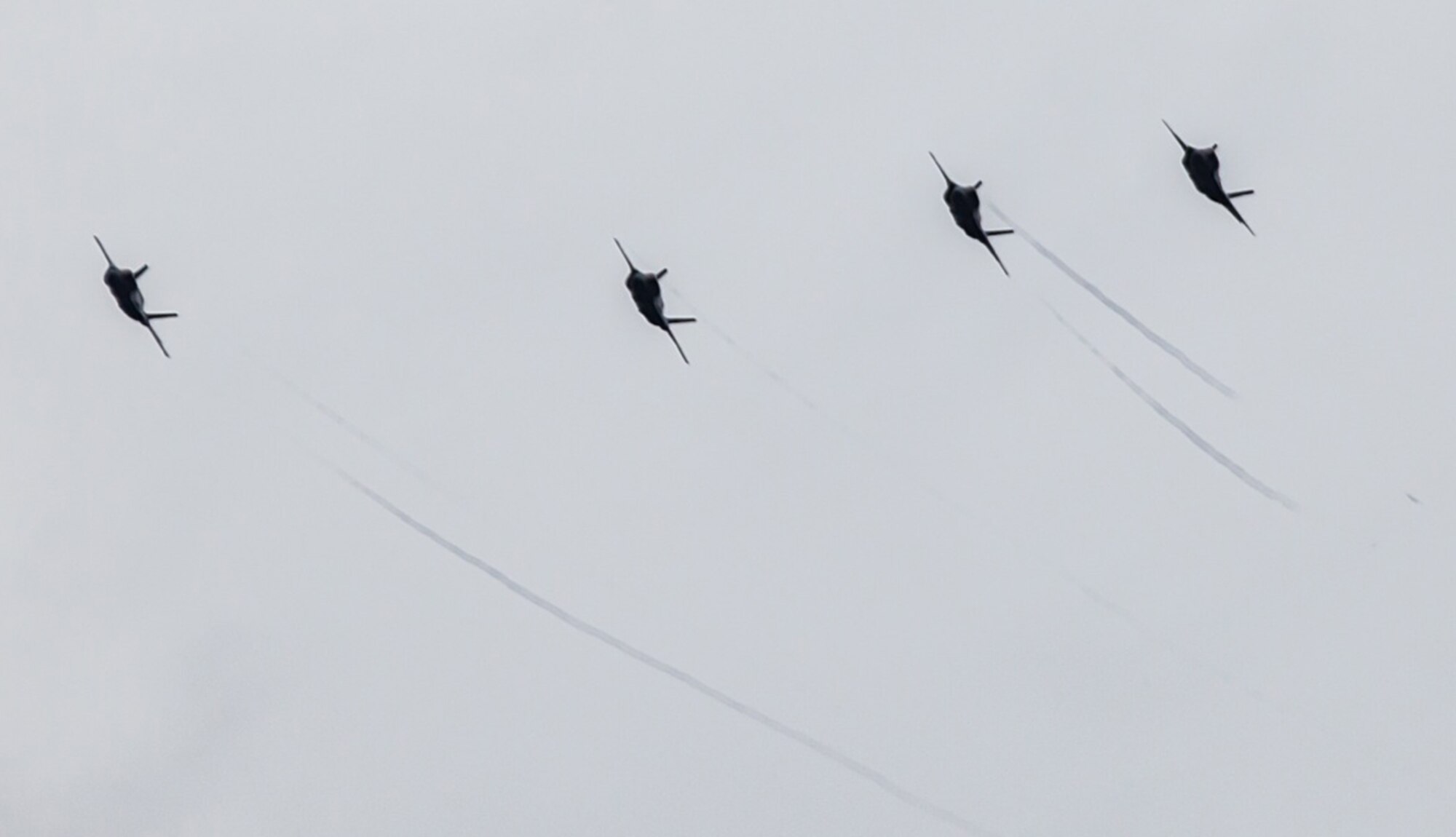Three United Kingdom F-35 Lightning IIs fly with a Marine Corps F-35B through the cloudy skies over Eglin Air Force Base, Fla., Dec. 4.  The joint-program reached a new single-day record for F-35 sorties Dec. 4 with 45 training missions between all three models of the aircraft.  The Marine B-model completed 32 of the flights, the Air Force A-model had 10 flights and the Navy C-model flew three missions.  (Courtesy photo/Andy Poulastides)