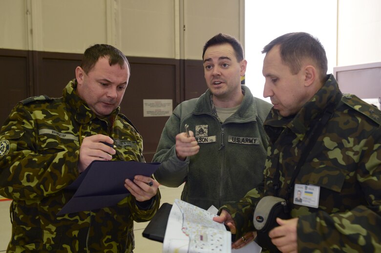 SPANGDAHLEM AIR BASE, Germany – Ukrainian inspectors evaluate an authorized facility on Spangdahlem Air Base Dec. 5, 2013. The inspection took place as part of the Conventional Armed Forces in Europe treaty signed in 1990. (U.S. Air Force photo by Airman 1st Class Kyle Gese/Released)