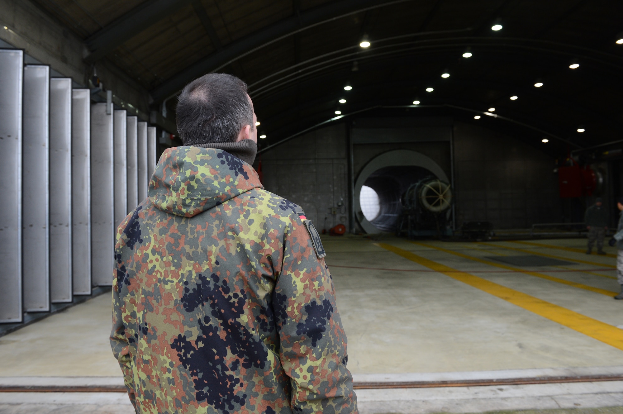 SPANGDAHLEM AIR BASE, Germany – A Ukrainian inspector looks at an empty facility on Spangdahlem Air Base Dec. 5, 2013. Inspectors evaluated the base to determine the compliance with the Conventional Armed Forces in Europe treaty. (U.S. Air Force photo by Airman 1st Class Kyle Gese/Released)
