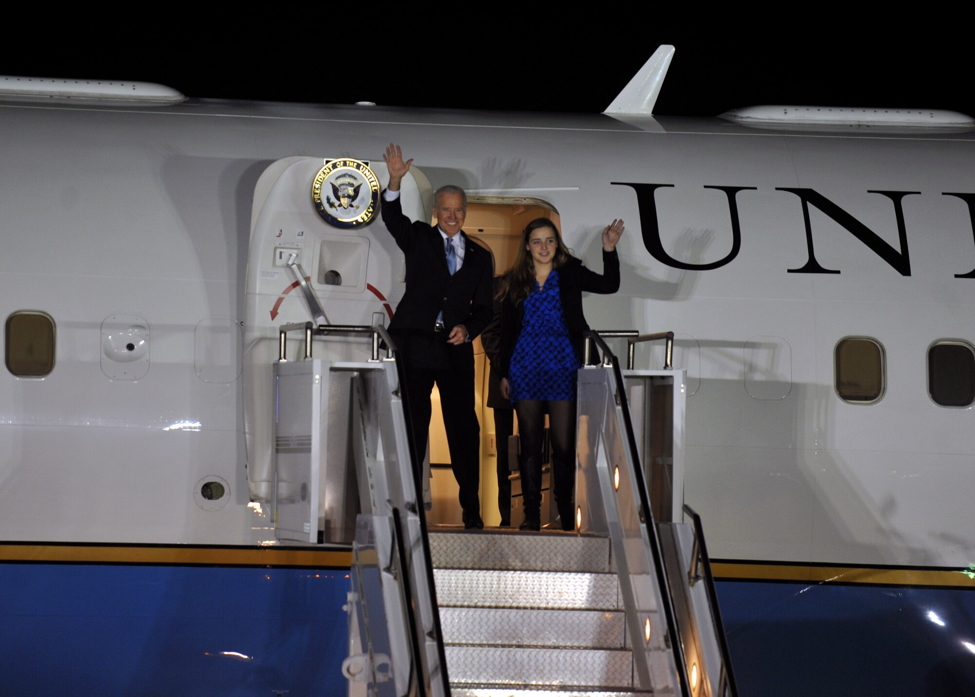 U.S. Vice President Joe Biden and his granddaughter Finnegan Biden wave to onlookers as they exit Air Force Two at Osan Air Base, Republic of Korea, Dec. 5, 2013. Biden is in Korea to strengthen U.S.-ROK relations and speak about the U.S. policy towards the Asia-Pacific region. (U.S. Air Force photo/Senior Airman Siuta B. Ika)