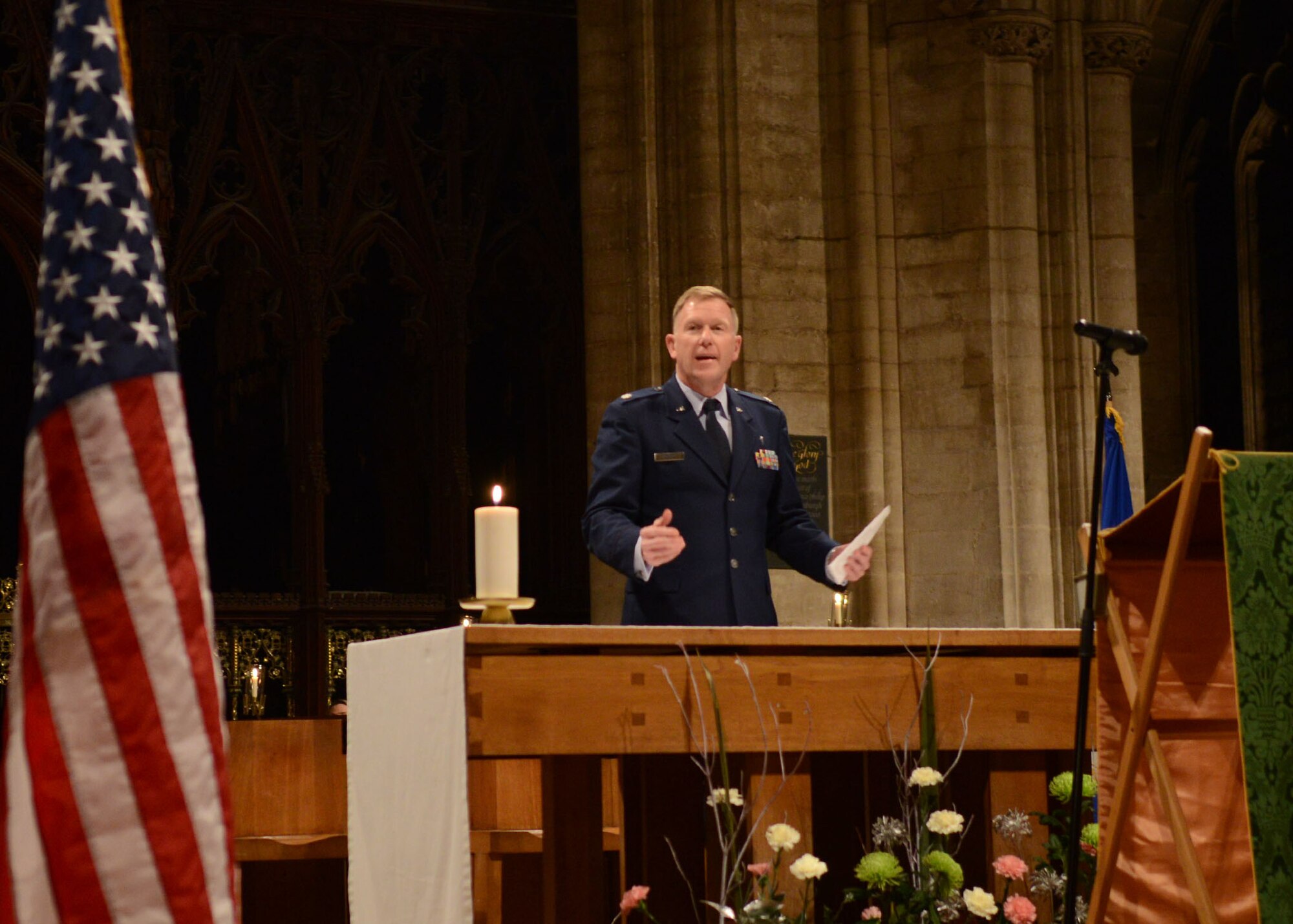 Chaplain (Lt. Col.) Gerald Snyder, 48th Fighter Wing chaplain, speaks to attendees of the annual Thanksgiving Eve Service at Ely Cathedral in Ely, England, Nov. 27, 2013. The local community, service members and their families attended this service, which concluded with a pie social. (U.S. Air Force photo by Airman 1st Class Kyla Gifford/Released)