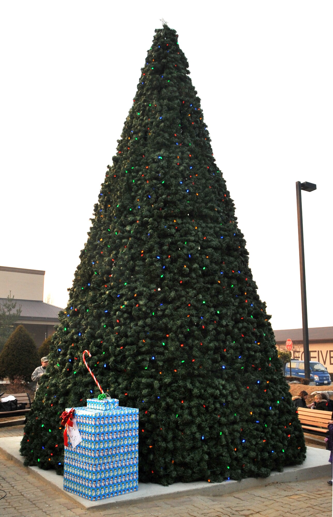 The base Christmas tree waits to light up the night at the conclusion of the Christmas tree lighting ceremony at Osan Air Base, Republic of Korea, Dec. 4, 2013. The ceremony was a joint venture involving cooperation from the 51st Fighter Wing Chapel, the 51st Civil Engineer Squadron and the 51st Security Forces Squadron. (U.S. Air Force photo/Airman 1st Class Ashley J. Thum)