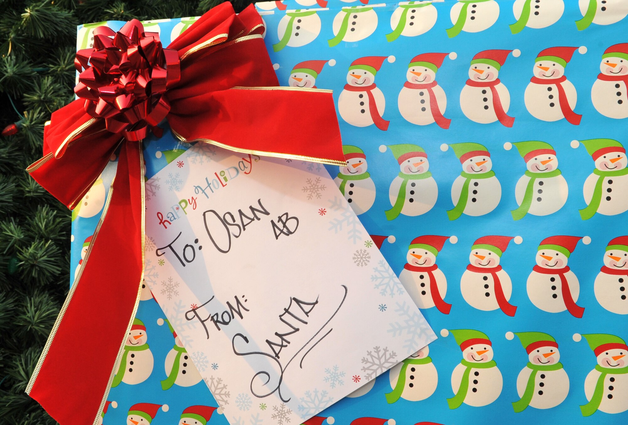 A giant gift box holds the light switch for the Christmas tree during the lighting ceremony at Osan Air Base, Republic of Korea, Dec. 4, 2013. The annual event dates back more than 20 years. (U.S. Air Force photo/Airman 1st Class Ashley J. Thum)