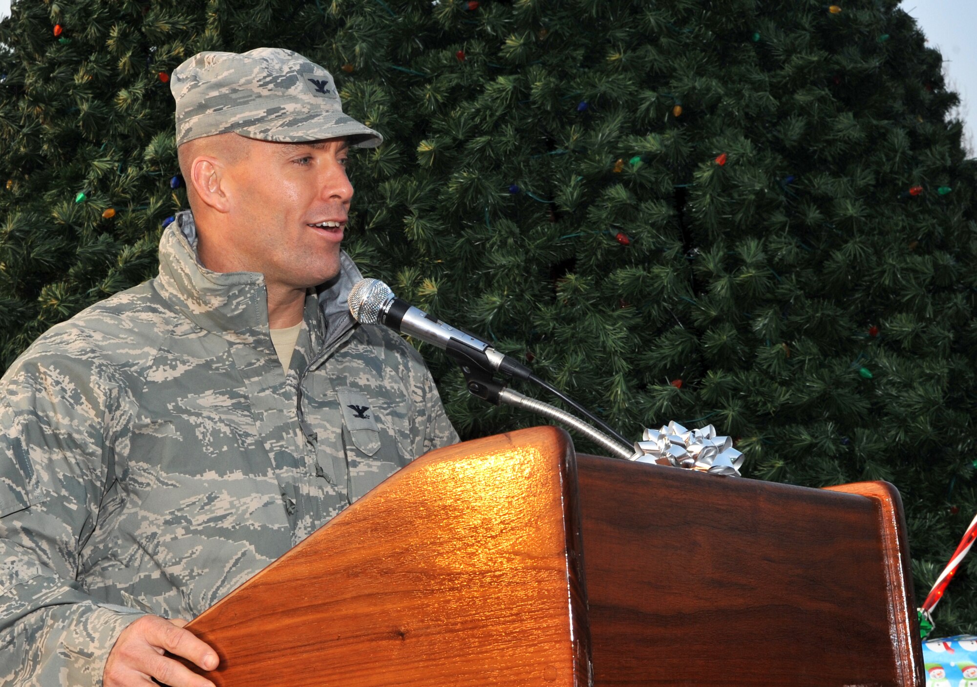 Col. Brook Leonard, 51st Fighter Wing commander, addresses service members and their families at the opening of the Christmas tree lighting ceremony at Osan Air Base, Republic of Korea, Dec. 4, 2013. Leonard encouraged everyone to take time during the holiday season to strengthen teamwork and the base’s sense of community. (U.S. Air Force photo/Airman 1st Class Ashley J. Thum)