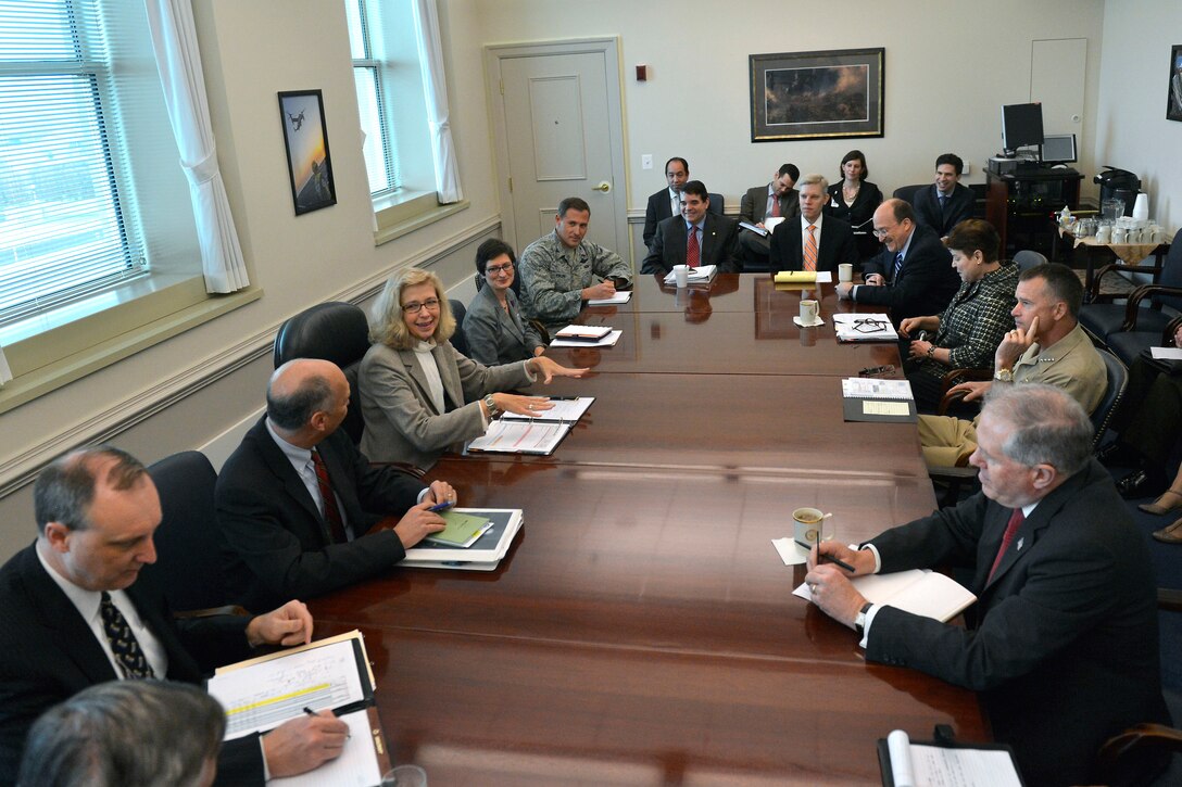 Acting Deputy Defense Secretary Christine H. Fox chairs a meeting of senior Pentagon officials as she begins her first day in her new position, Dec. 5, 2013, following the departure of outgoing Deputy Defense Secretary Ash Carter.