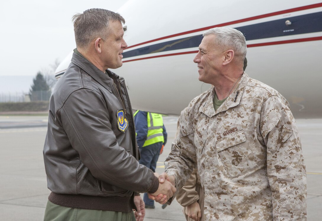 The Assistant Commandant of the Marine Corps, Gen. John M. Paxton, Jr., right, speaks with Air Force Gen. Frank Gorenc at Ramstein Air Base, Germany, Nov. 29, 2013. (U.S. Marine Corps photo by Cpl. Tia Dufour/Released)
