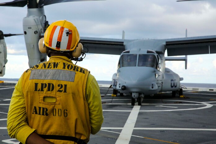 USS NEW YORK - Two MV-22 Osprey tilt-rotor aircraft land aboard USS New York on Dec. 5, 2013, while the ship heads to its new home port, Jacksonville, Fla. Visit the following link to read the story about the home port change: http://www.dvidshub.net/news/117821/uss-new-york-changes-home-ports.