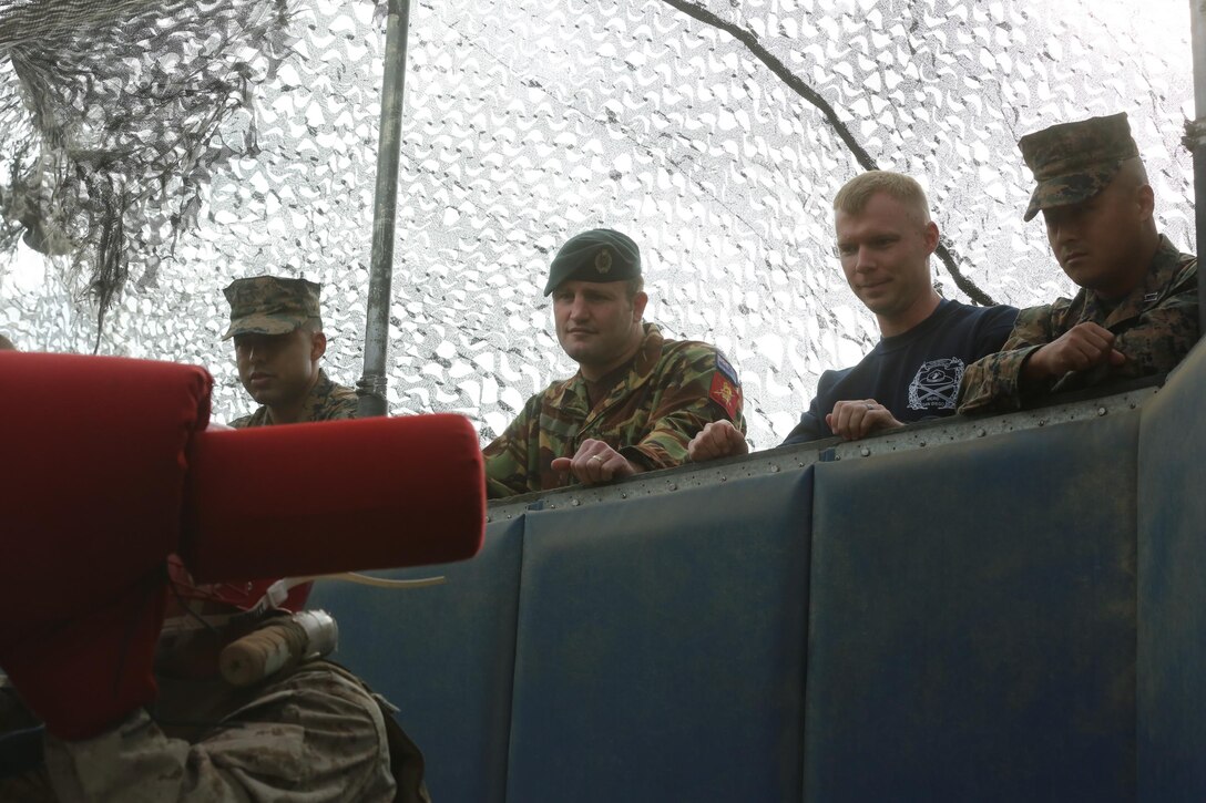 New Zealand Army Maj. Logan A. Vaughan watches a pugil sticks bout at the depot, Nov. 19. The purpose of the visit was to introduce Vaughan to some of the methods used in the making of Marines.