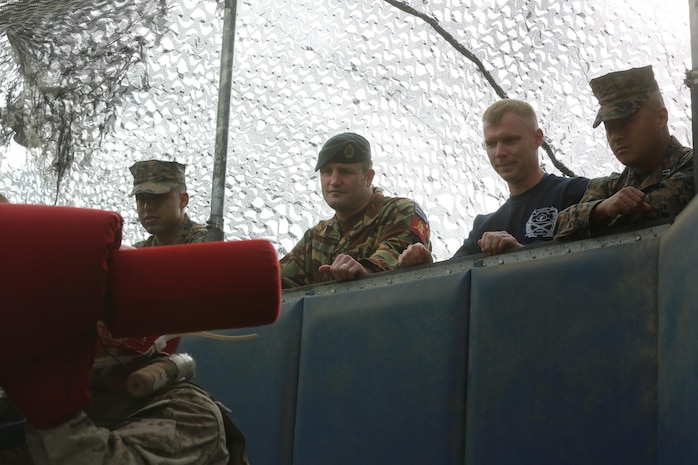 New Zealand Army Maj. Logan A. Vaughan watches a pugil sticks bout at the depot, Nov. 19. The purpose of the visit was to introduce Vaughan to some of the methods used in the making of Marines.