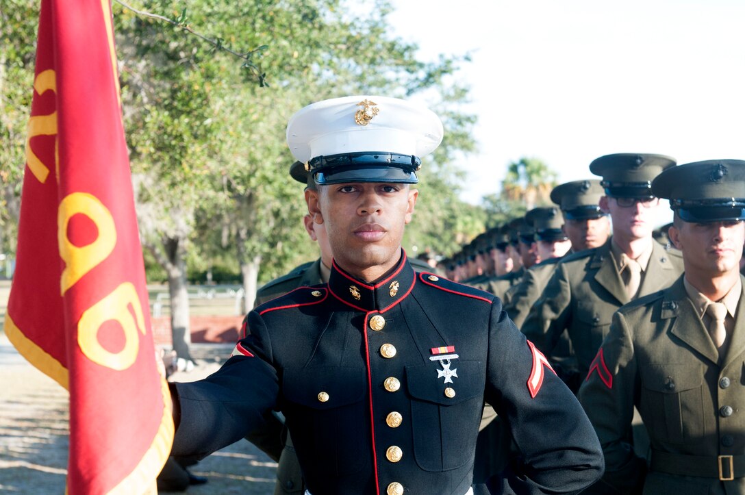 PARRIS ISLAND - S.C. - Pfc. Adame C. Clayton, honor graduate for platoon 2096, stands at parade rest before graduation aboard Parris Island, S.C., Dec. 6, 2013. Clayton, a native of Jacksonville, Fla., was recruited by Sgt. Catherine Light, a recruiter from Recruiting Substation Jacksonville Beach, Recruiting Station Jacksonville. Clayton is one of three siblings to serve in the United States Marine Corps. Younger brother, Rct. Ishmael Alim Clayton is currently in recruit training with Company E. and is scheduled to graduate Jan. 31, 2014. Older brother, Cpl. Elijah K. Clayton an assault amphibious vehicle commander, is assigned to the 3rd Assault Amphibian Battalion, Marine Corps Air Ground Combat Center, Twentynine Palms, Ca. (U.S. Marine Corps photo by Lance Cpl. Stanley Cao)

