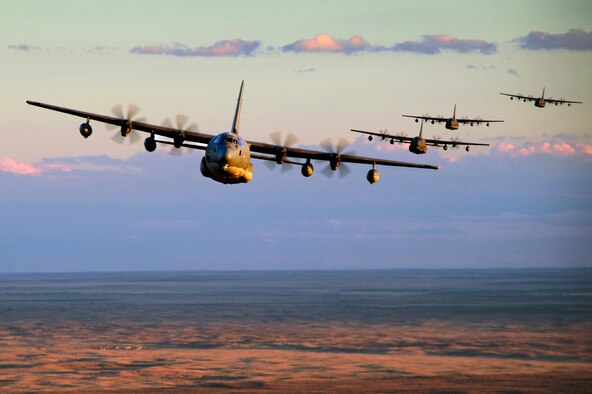 Five MC-130J Commando IIs conduct low-level formation training over Clovis, N.M., Nov. 5, 2013. The New Mexico landscape provides an optimal training environment for aircrews to hone their skills to meet the needs of the 27th Special Operations Wing. The aircraft are from the 522nd Special Operations Squadron at Cannon Air Force Base, N.M. (U.S. Air Force photo/Staff Sgt. Matthew Plew)