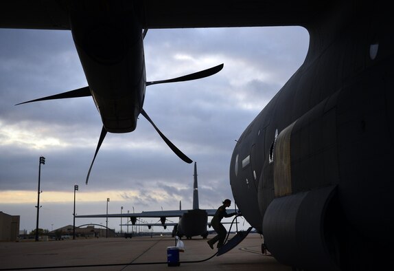 Capt. Heather Lendrum enters a C-130J Super Hercules during Impact Day Nov. 21, 2013, at Dyess Air Force Base, Texas. Impact Day is an opportunity for aircrew personnel to familiarize themselves with the maintainers’ responsibilities and vice versa. This training exercise was designed for team building, appreciation and familiarity to ensure mission effectiveness. Lendrum is a 39th Airlift Squadron C-130J pilot. (U.S. Air Force photo/Staff Sgt. Vernon Young Jr.)
