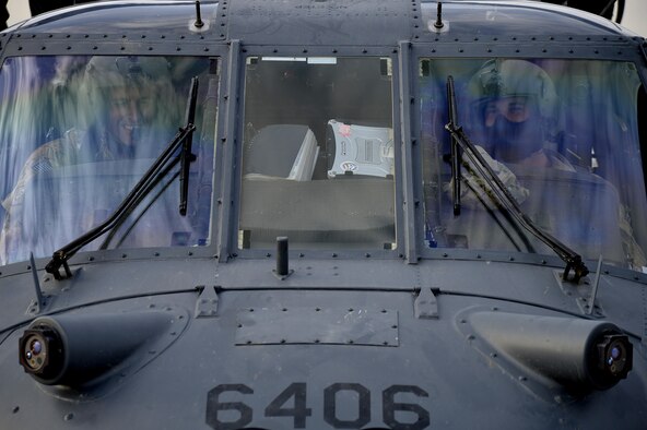 Two Air Force pilots assigned to the 83rd Expeditionary Rescue Squadron prepare for a training mission Nov. 22, 2013, at Bagram Airfield, Afghanistan. The 83rd ERQS performs their training missions to ensure they maintain proficiency of their mission capabilities. (U.S. Air Force photo/Senior Airman Kayla Newman)